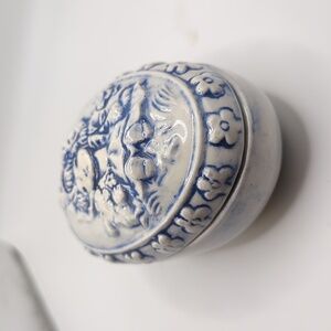 Ceramic blue and white egg shape with image of a girl Trinket Box